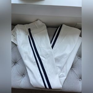 Mother white bootcut jeans with sparkly navy stripes down side of legs. Size 26.